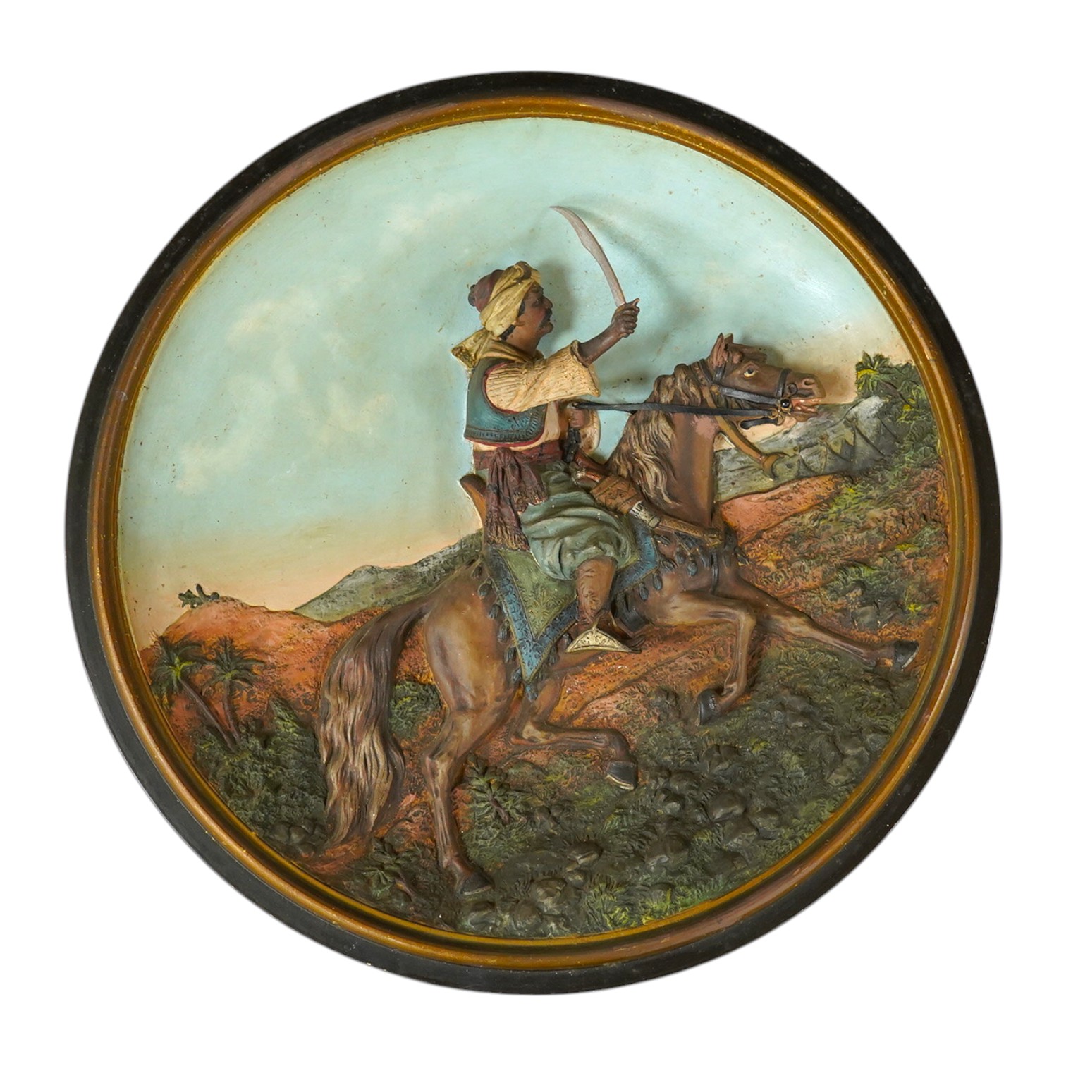 A Johann Maresch cold painted terracotta dish, decorated in relief with a Turk on horseback, 39cm in diameter. Condition - good, painted wood sword blade